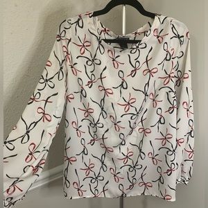 Long sleeved blouse with bow pattern